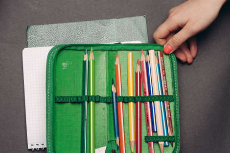 green pencil case with pencils design object school suppliesの写真素材