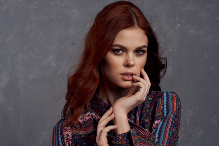 woman in coat fashionable clothes glamor red hair model