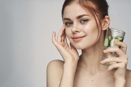 woman with bare shoulders cucumber health drink Freshの写真素材