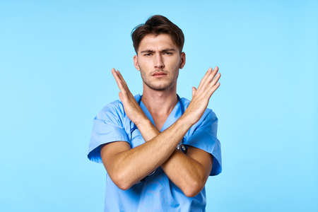 male doctor health care treatment stethoscope examination blue backgroundの写真素材