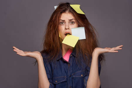 woman pasted over with stickers student tasks dark backgroundの写真素材