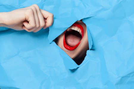 womans face breaks through blue mockup close-up