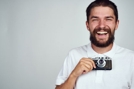 bearded man camera professional technology light backgroundの写真素材