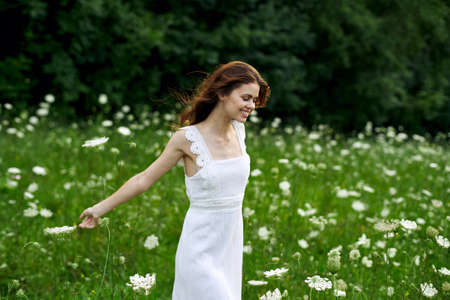cheerful woman outdoors flowers freedom summer natureの写真素材