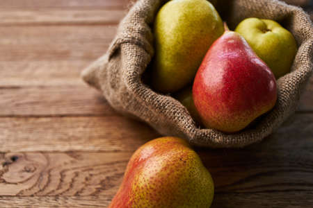 pears on wooden table agriculture vitamins close-upの写真素材