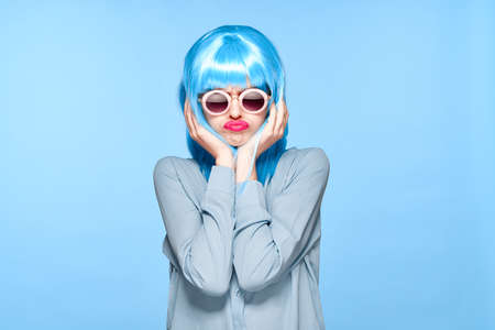 emotional woman in black wig shirt fashion posingの写真素材