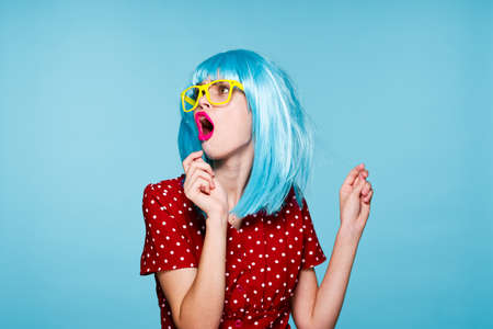 cheerful woman purple hair yellow glasses fashion glamorの写真素材