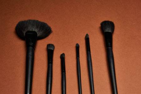 makeup brushes mascara accessories glamor brown background