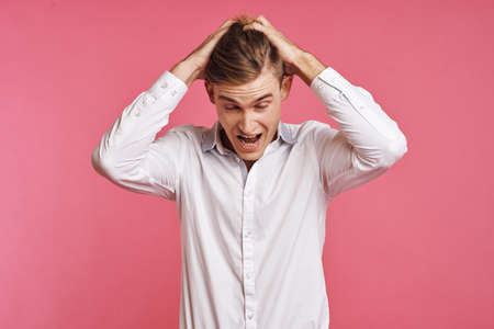 portrait of a man posing white shirt fashion self confidence isolated backgroundの写真素材