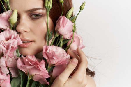 beautiful woman pink flower bouquet fashion summer light backgroundの写真素材