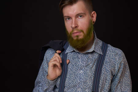 business man in shirt with jacket over his shoulders posing self confidenceの写真素材