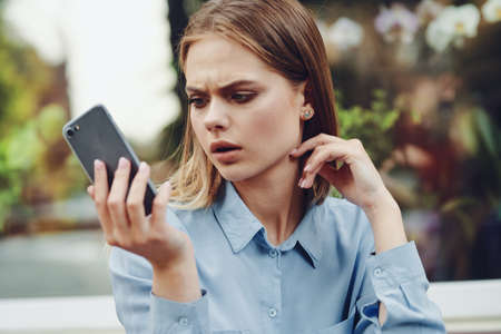 Business woman in a cafe in the summer outdoors on vacationの写真素材