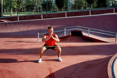 athletic man in red jersey workout exercise pumped up bodyの写真素材