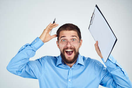 bearded man in blue shirt documents manager professionalの写真素材