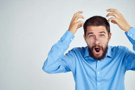 bearded man manager work emotions posing light backgroundの写真素材