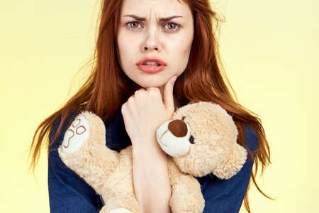 cheerful woman with teddy bear fashion posing holidayの写真素材