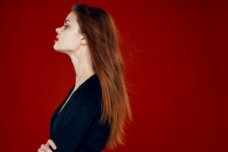 pretty woman with red lips red hair Glamor posing red background
