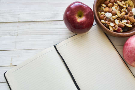 diet notebook fruit healthy food breakfast light backgroundの写真素材