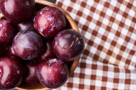 plums fruits natural products on a wooden table top viewの写真素材
