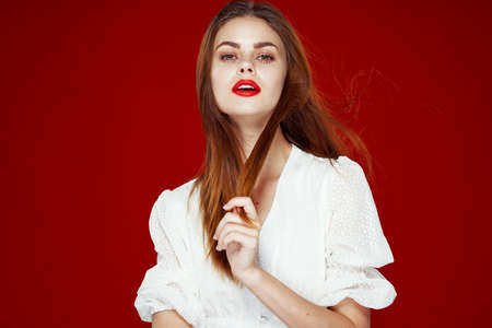 pretty woman fashion hairstyle posing red lips isolated backgroundの写真素材