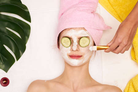 cheerful woman spa treatments cosmetics beauty saloon view from aboveの写真素材