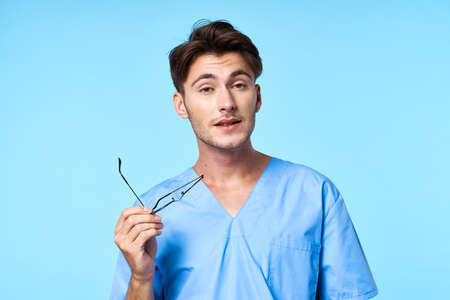 nurse with glasses patient history blue backgroundの写真素材