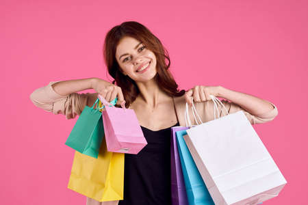 glamorous woman multicolored packs emotions shopping fashion isolated backgroundの写真素材
