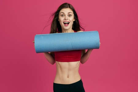 pretty woman workout exercise gym pink backgroundの写真素材