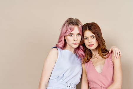 two women in fashionable clothes posing model decorationの写真素材