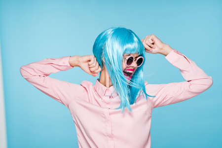 Glamorous woman blue wig makeup fashion posingの写真素材