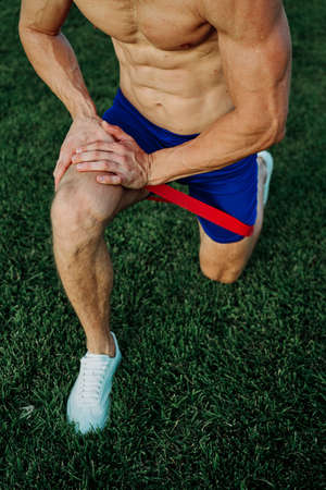 athletic man working out in the park crossfit exerciseの写真素材