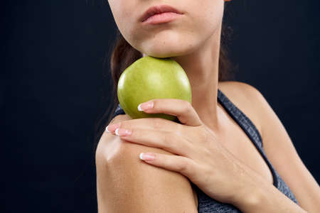 athletic woman slim figure green apple healthの写真素材