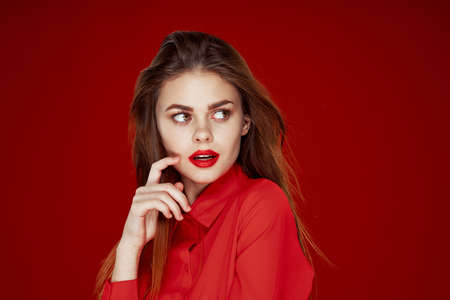 woman in red shirt posing fashion red lips funの写真素材
