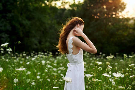 pretty woman in white dress field flowers freedom natureの写真素材