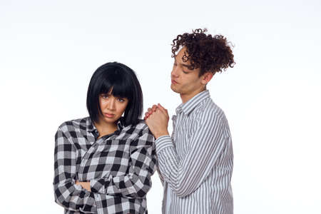 young couple modern clothes posing fun friendshipの写真素材