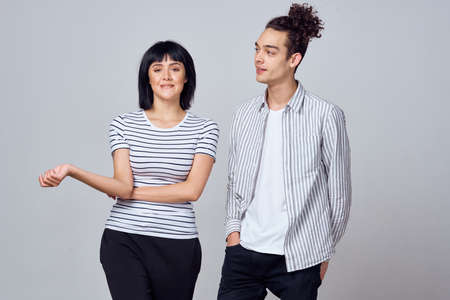 young couple modern clothes posing fun friendshipの写真素材