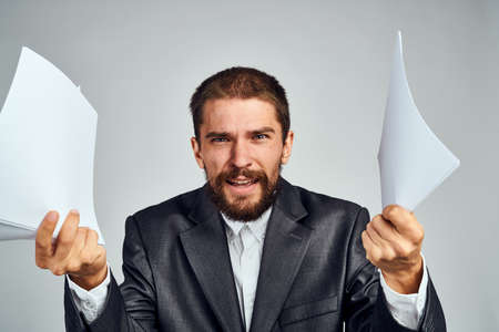 business man with documents in hands emotions manager office professionalsの写真素材