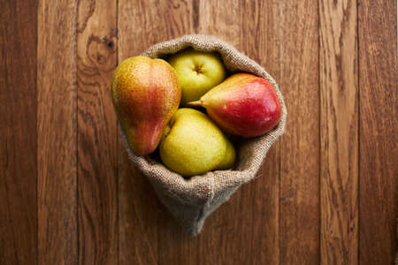 pears on wooden table agriculture vitamins close-upの写真素材