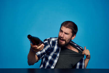 drunk man drinking beer alcohol emotion isolated backgroundの写真素材