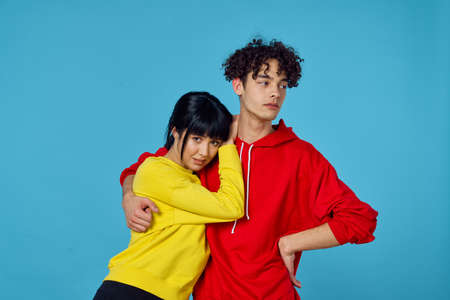 young couple in fashionable clothes posing together emotions lifestyleの写真素材