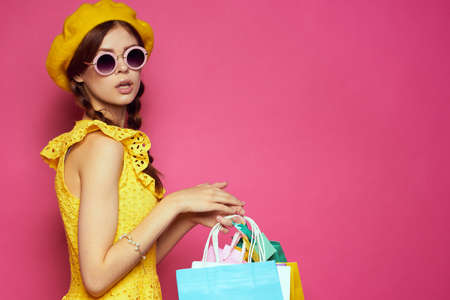 pretty woman shopping entertainment lifestyle pink backgroundの写真素材