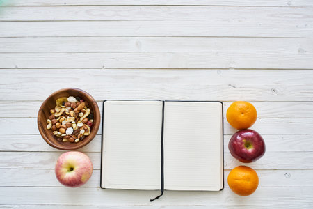 notepad on table measuring tape fruit breakfast nutritional fitness
