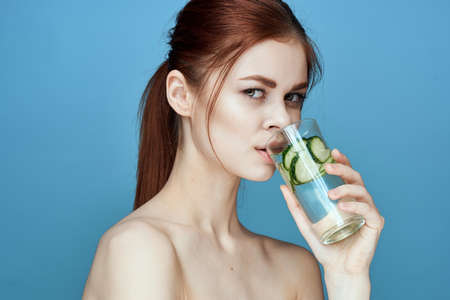 pretty woman with cucumber drink health vitaminsの写真素材