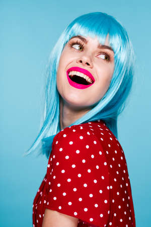 cheerful woman in a red dress according to the formula hair makeup modelの写真素材