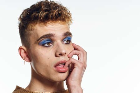 man with bright female makeup posing transgender freedom discriminationの写真素材