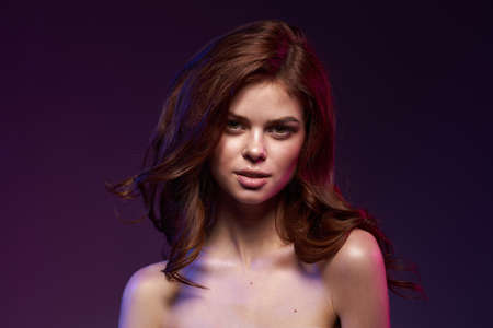 beautiful woman attractive look bare shoulders charm dark backgroundの写真素材