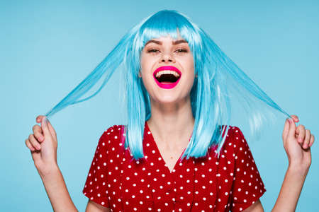 cheerful woman in a red dress according to the formula hair makeup modelの写真素材