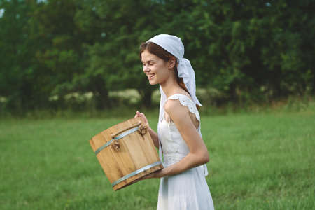 Woman in white dress countryside village nature ecologyの写真素材