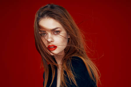 red-haired woman with red lips posing hairstyle glamorの写真素材