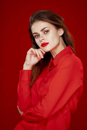 woman in red shirt posing fashion red lips funの写真素材